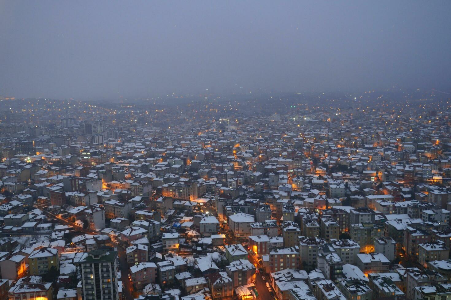 top view of Snowfall on buildings in istanbul city photo