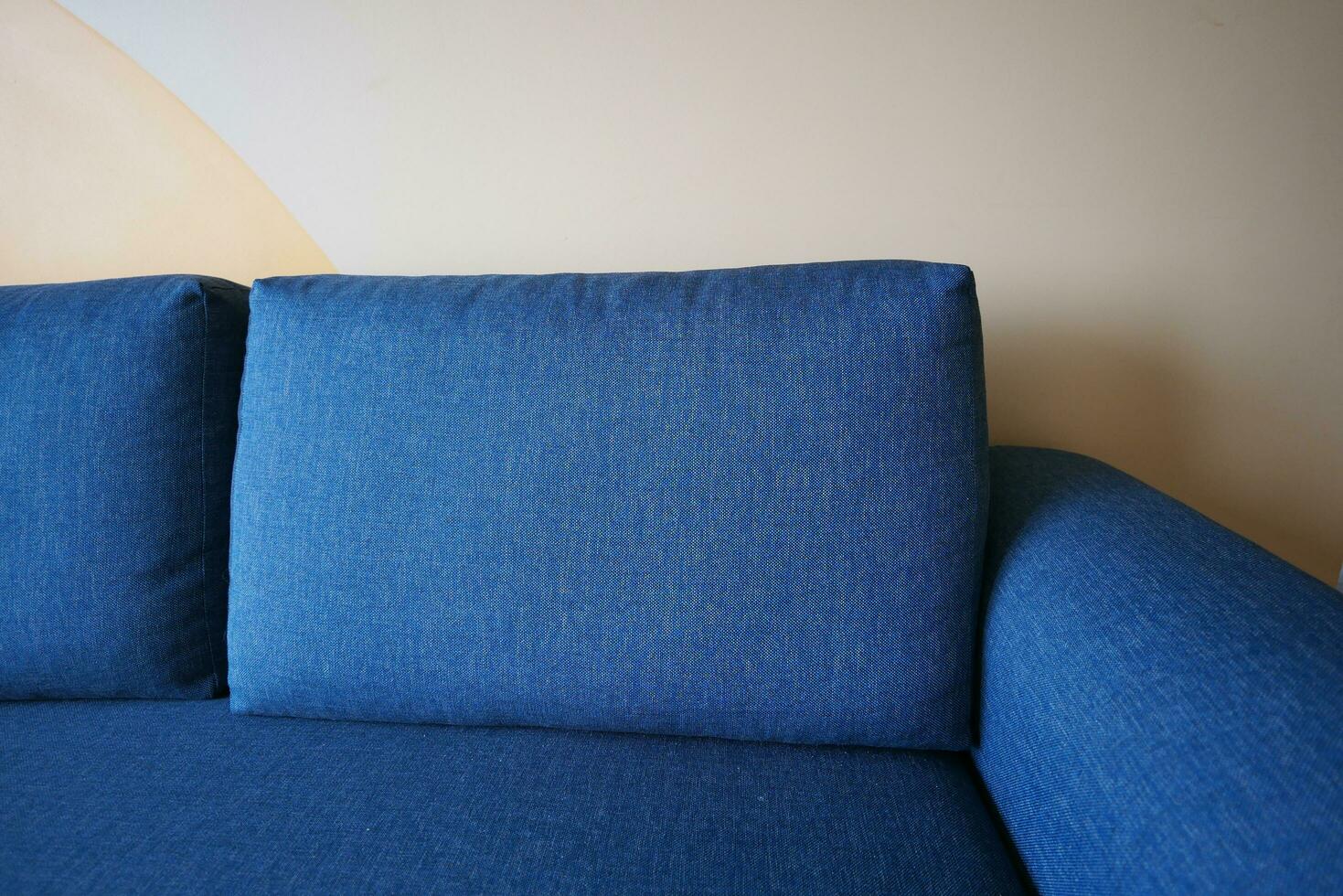 modern blue sofa with pillows in living room at home photo