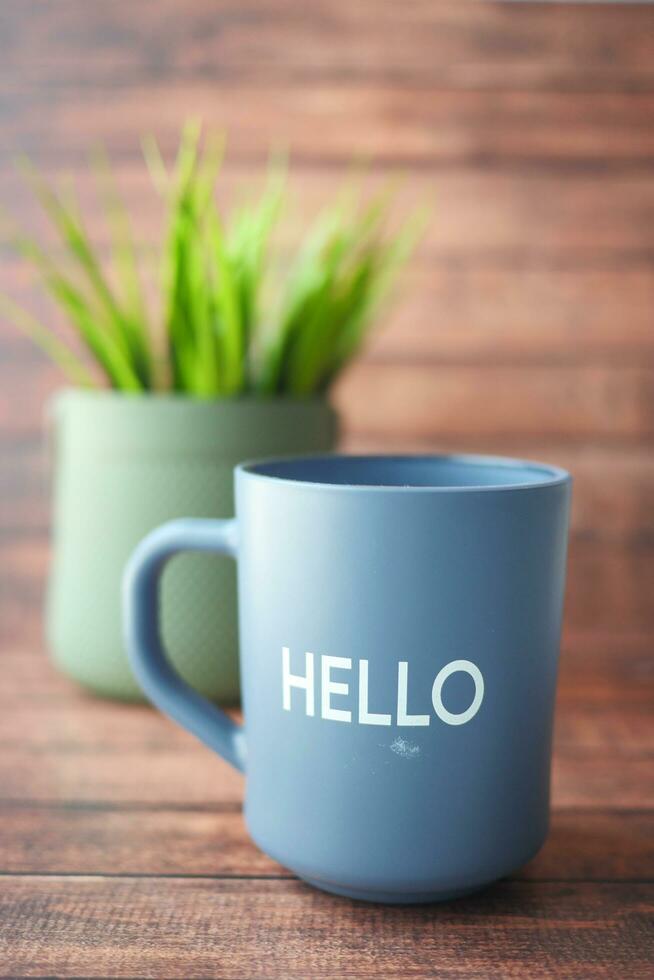 blue coffee cup with hello word photo