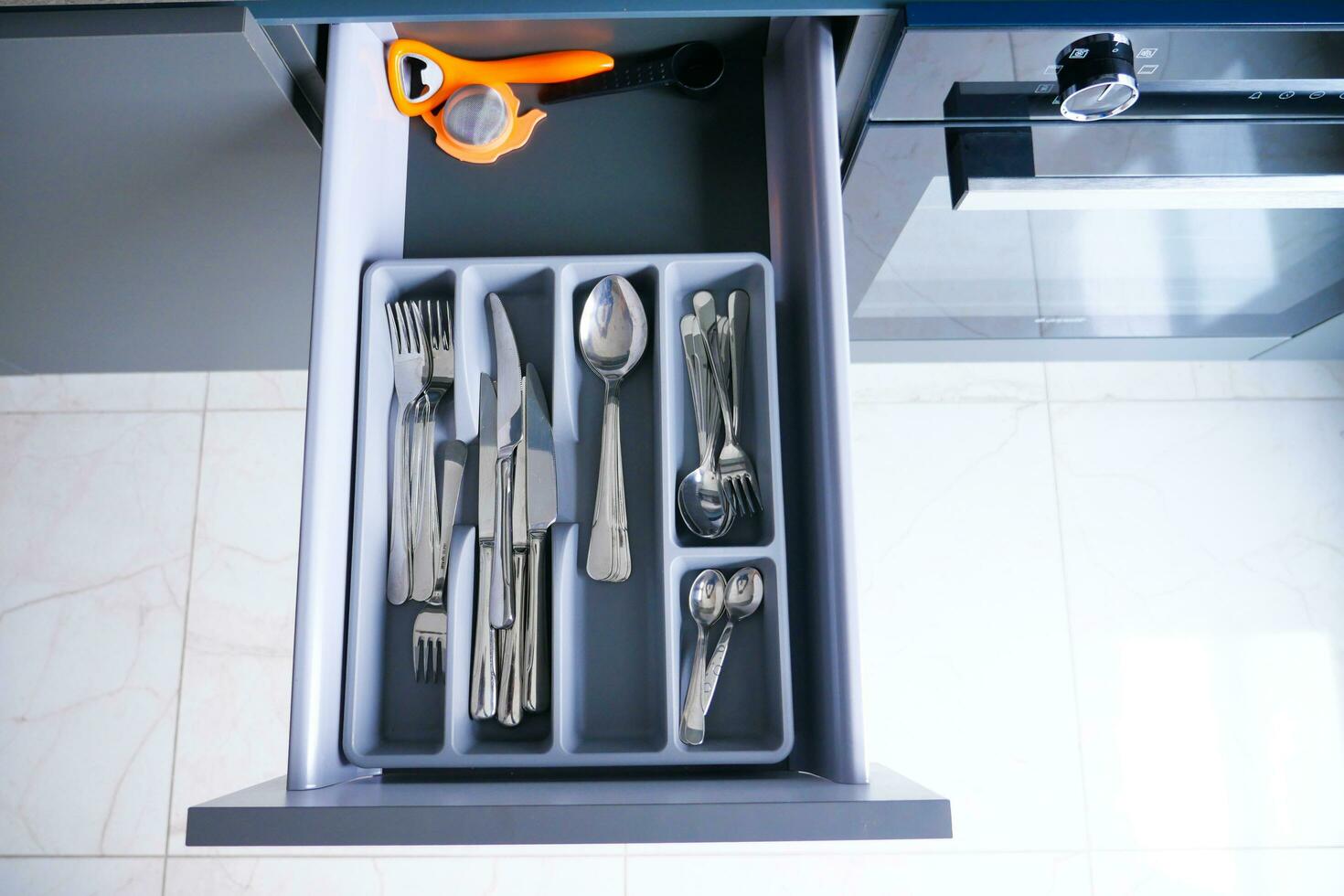 cutlery fork with knife and spoon in a drawer photo