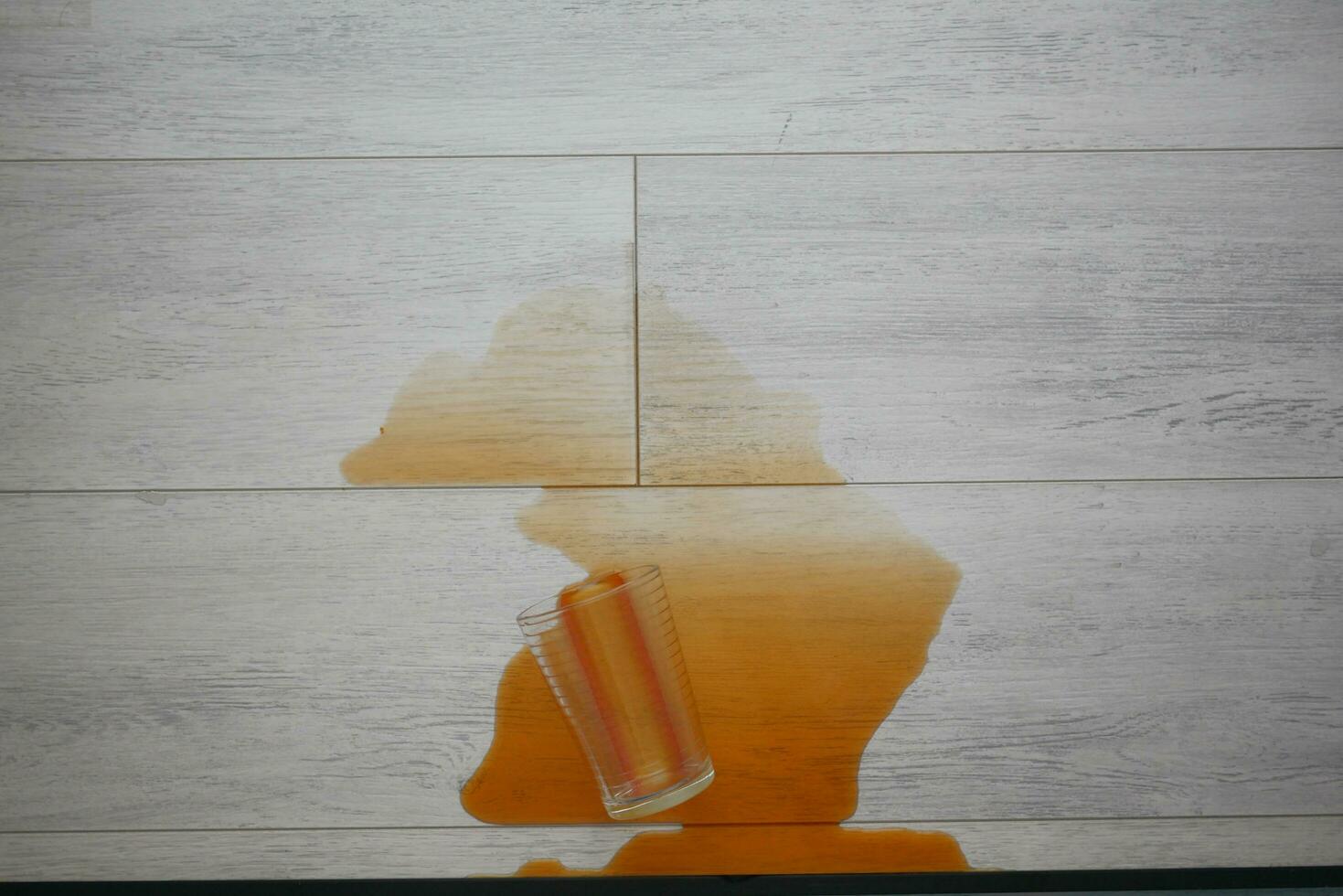 coffee spilled on a floor top view photo