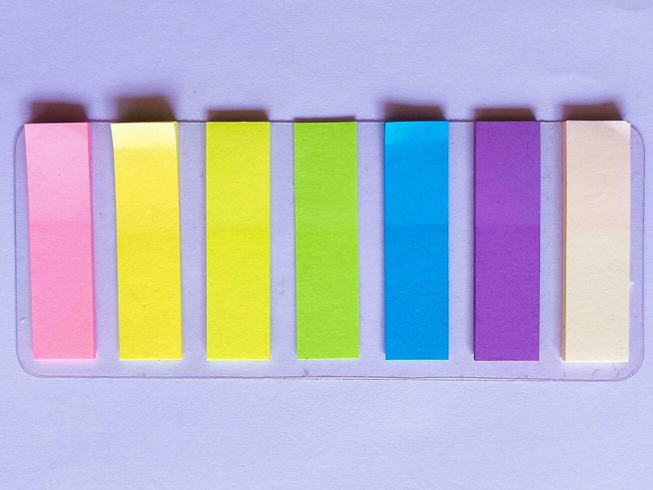 colourful sticky note with pencil and pen on the top for study, bussines photo
