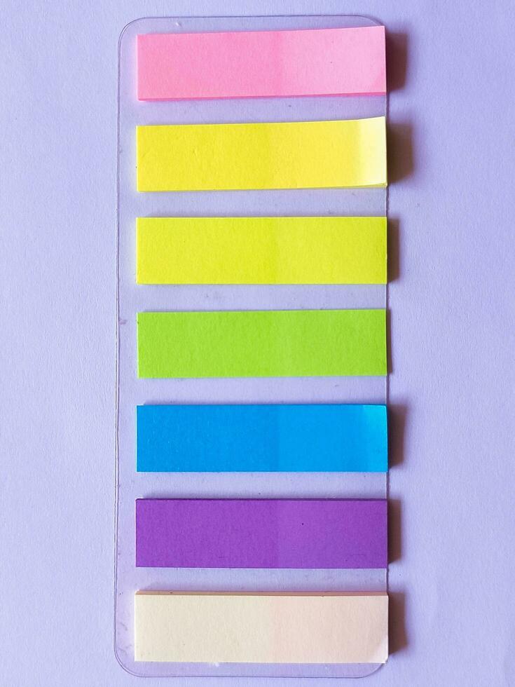 colourful sticky note with pencil and pen on the top for study, bussines photo