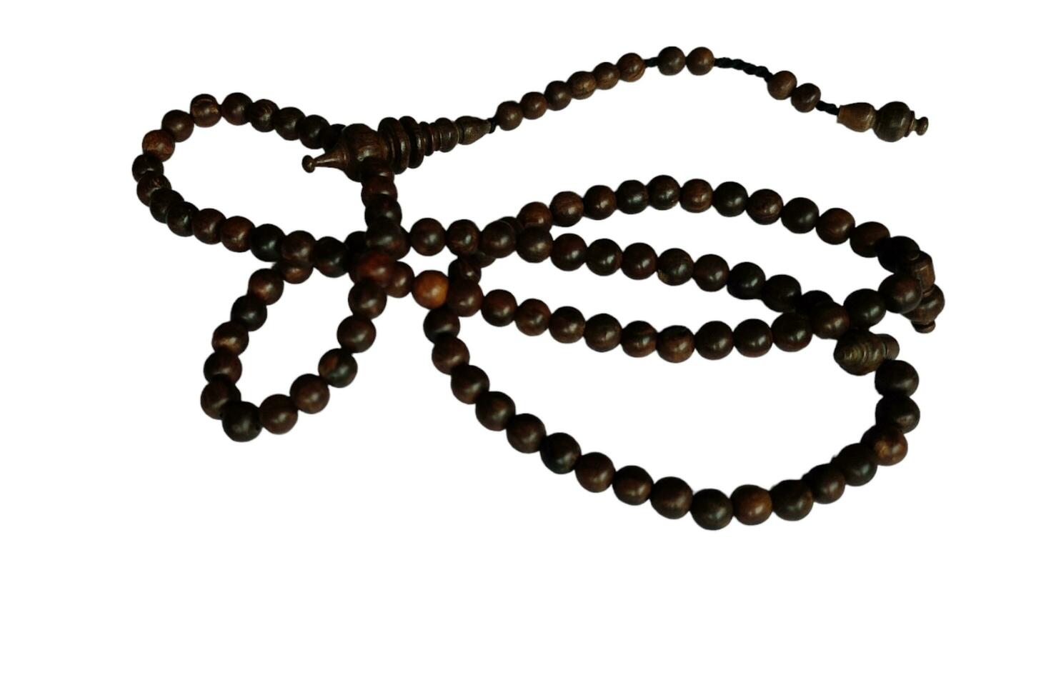 Tasbih oud solid wood for pray to allah to muslim religion photo