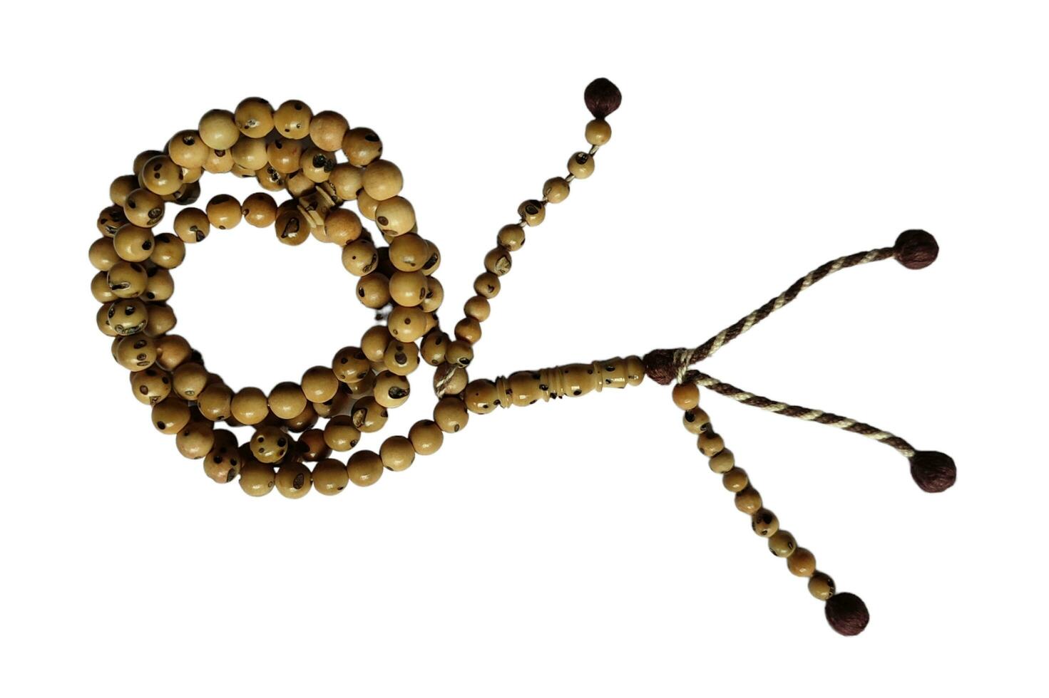 Tasbih oud solid wood for pray to allah to muslim religion photo