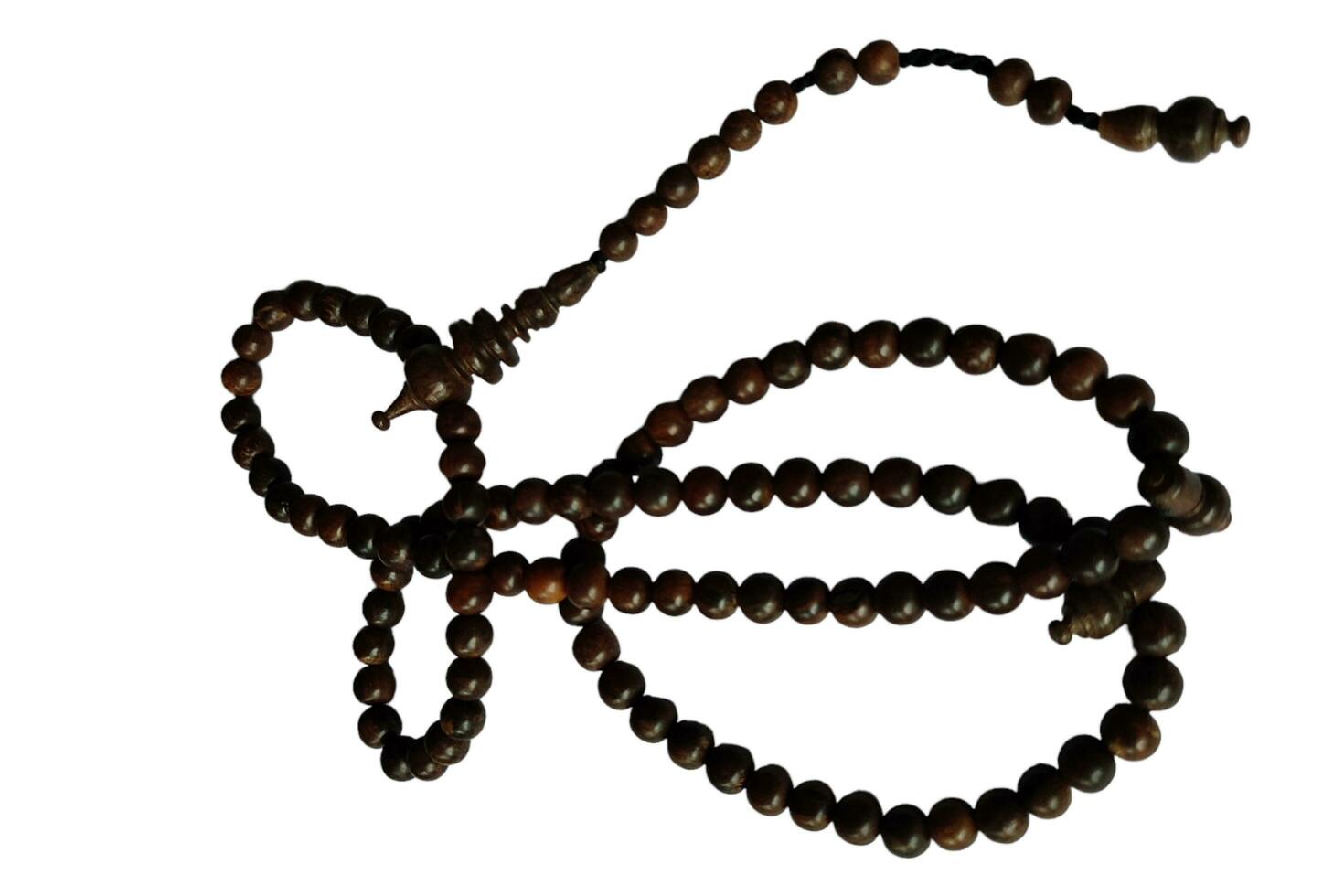 Tasbih oud solid wood for pray to allah to muslim religion photo