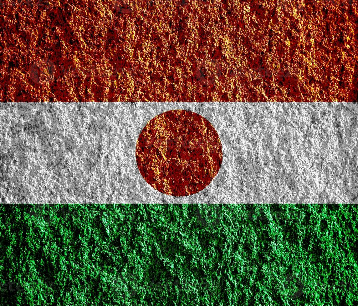 Flag of Republic of Niger on a textured background. Concept collage. photo