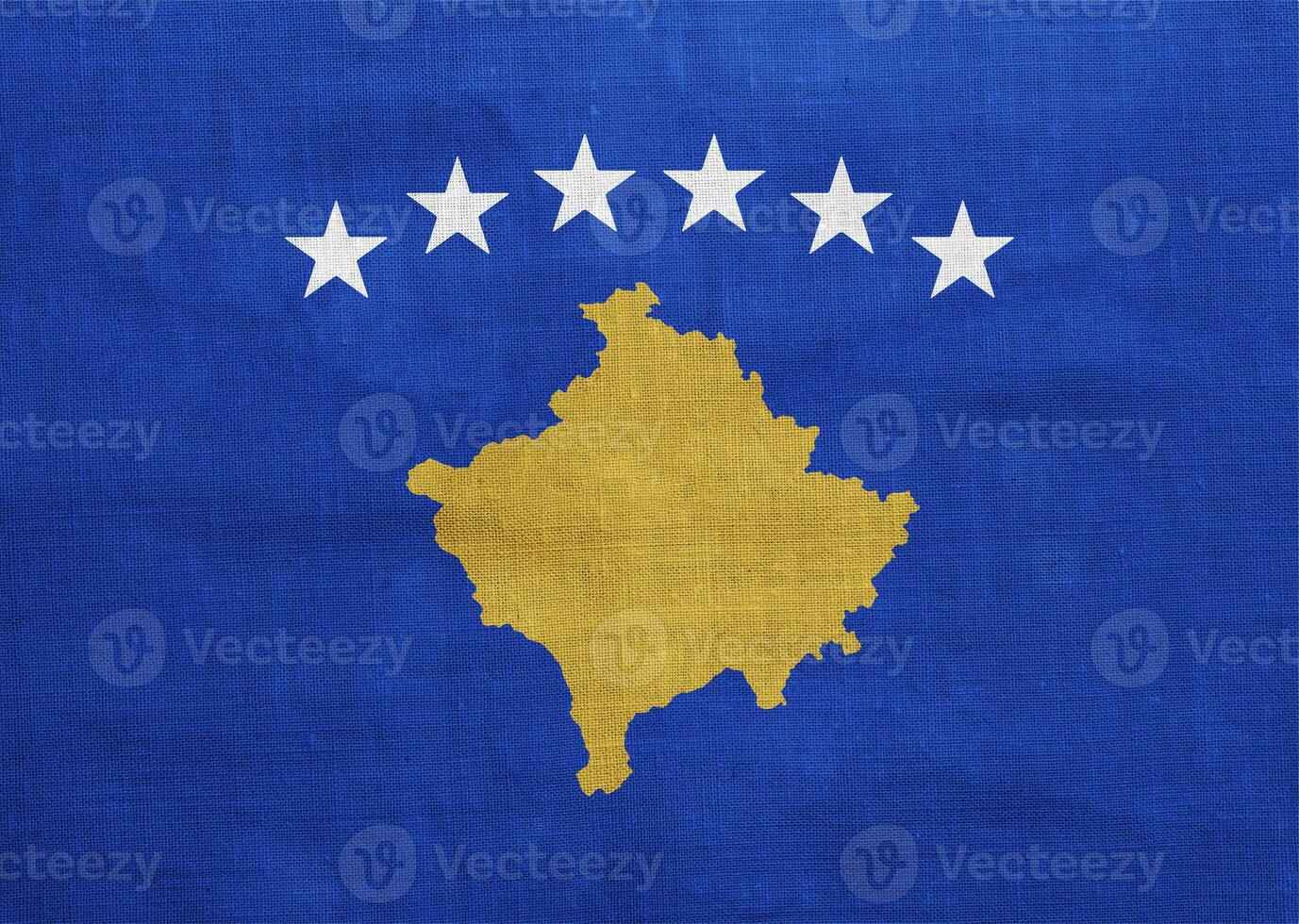 Flag of Republic of Kosovo on a textured background. Concept collage. photo