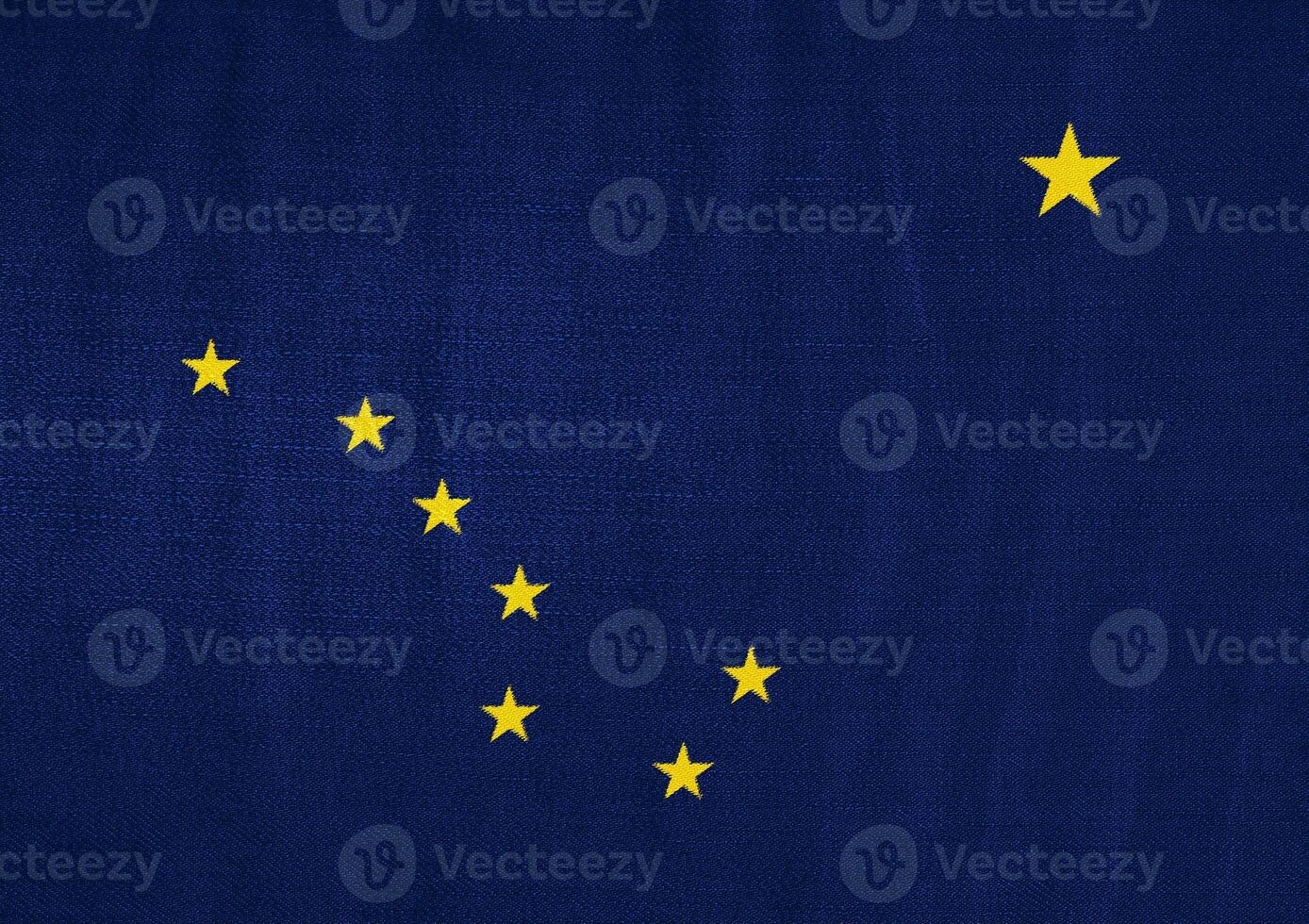 Flag of USA state Alaska on a textured background. Concept collage. photo