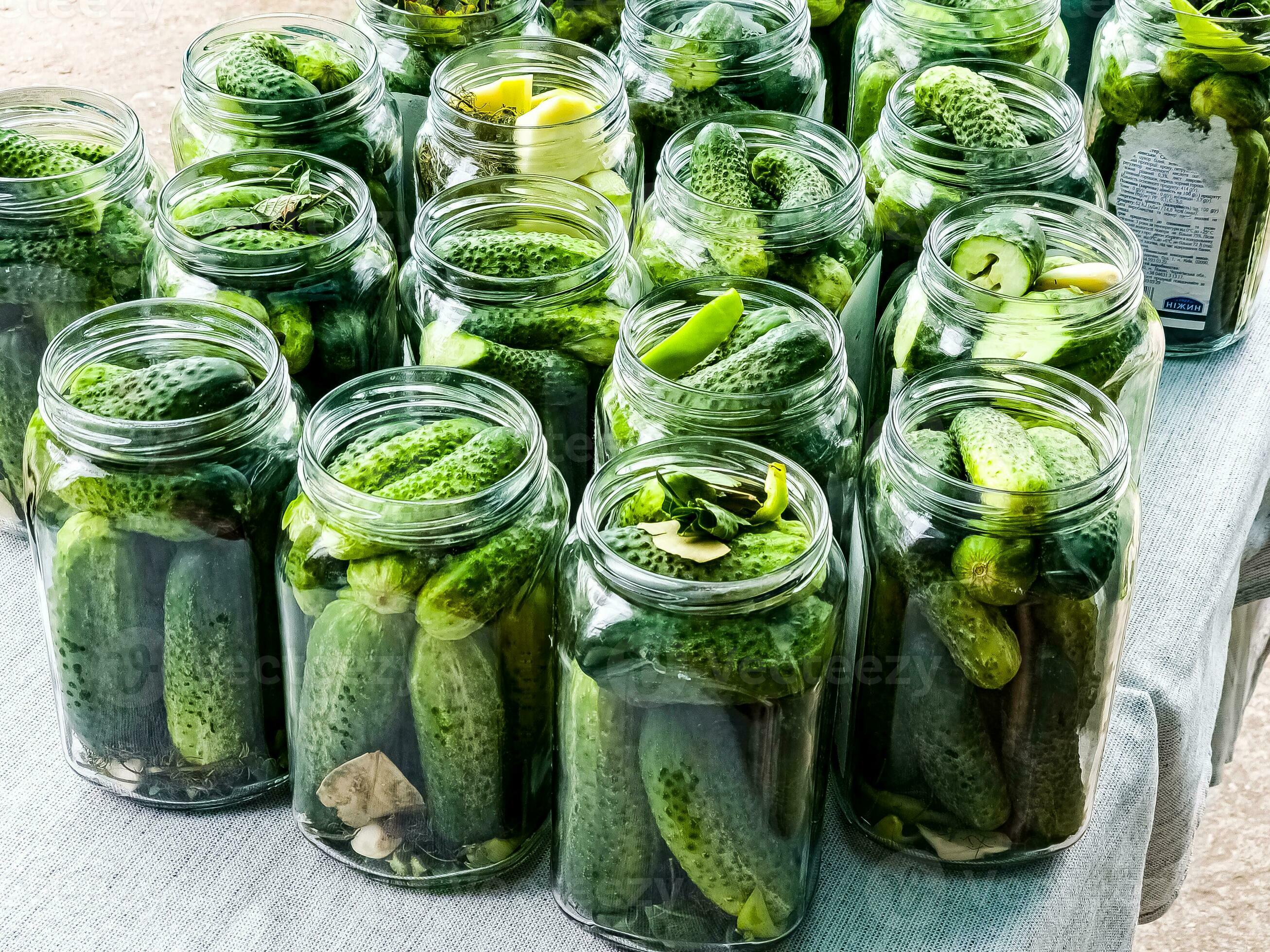 The process of pickling cucumbers for the winter in glass jars