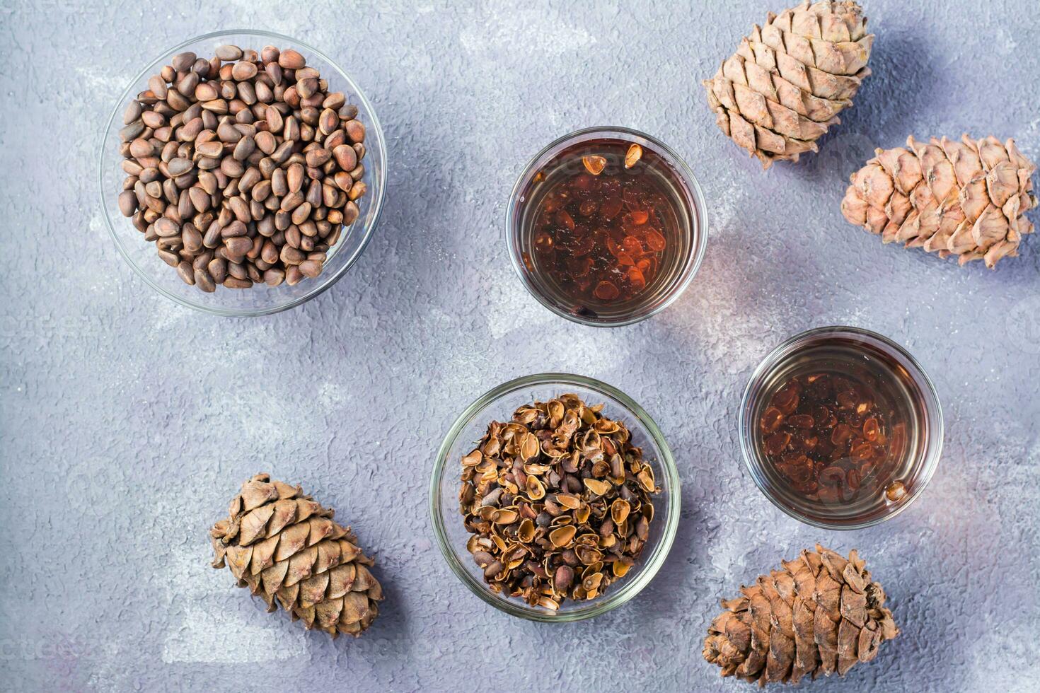 Infusion of pine nut shells in glasses and pine nuts on the table. Alternative medicine. Top