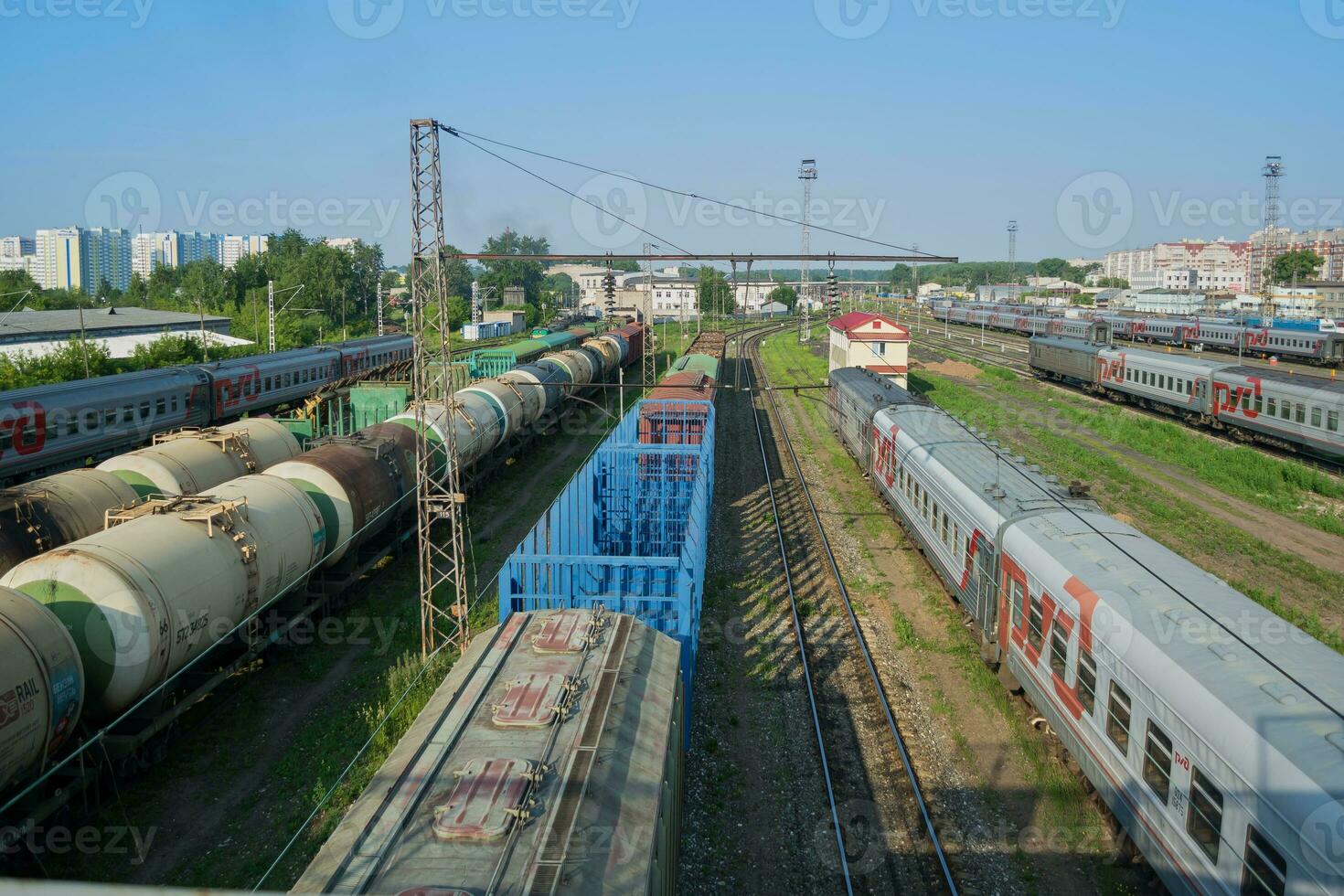 Train cars on rails at the station and freight cars, top view photo