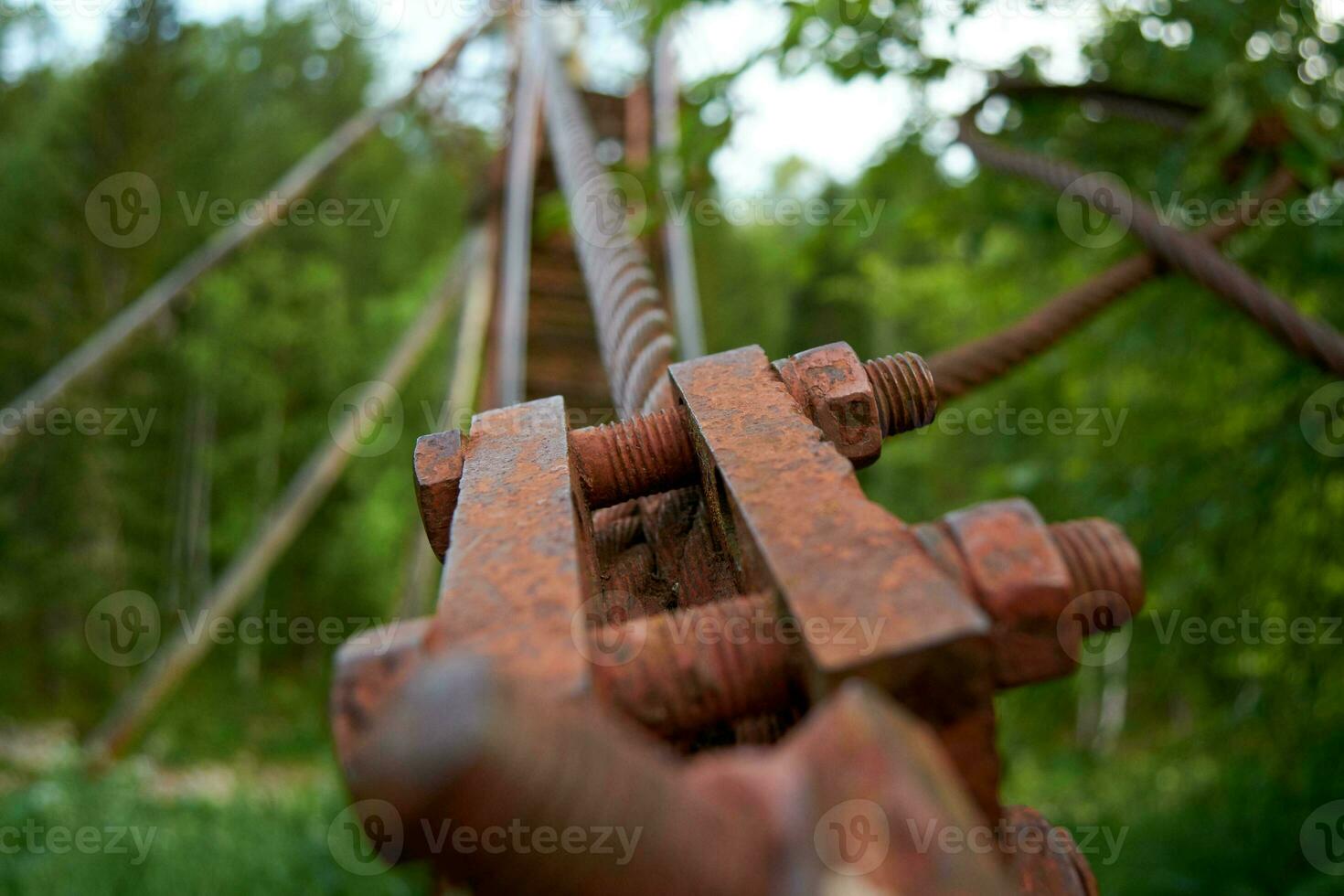 Old Rusty Metal Bolt, suspension bridge in the Oleniye Ruchiye Nature Park in the Sverdlovsk region photo