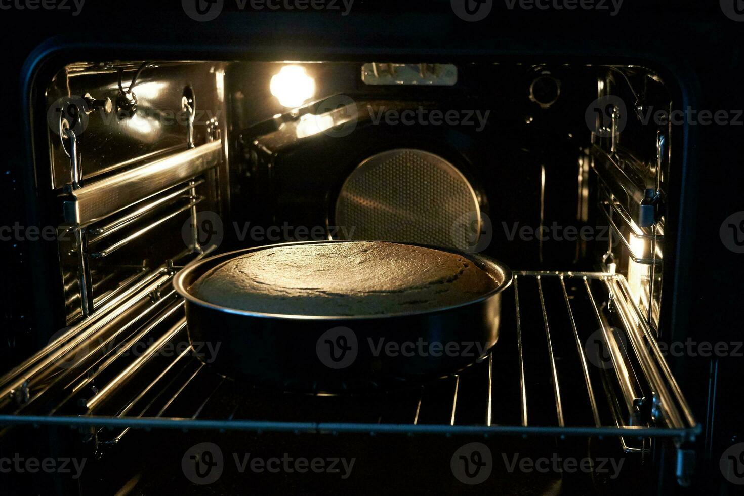 The cake is cooked in the oven photo