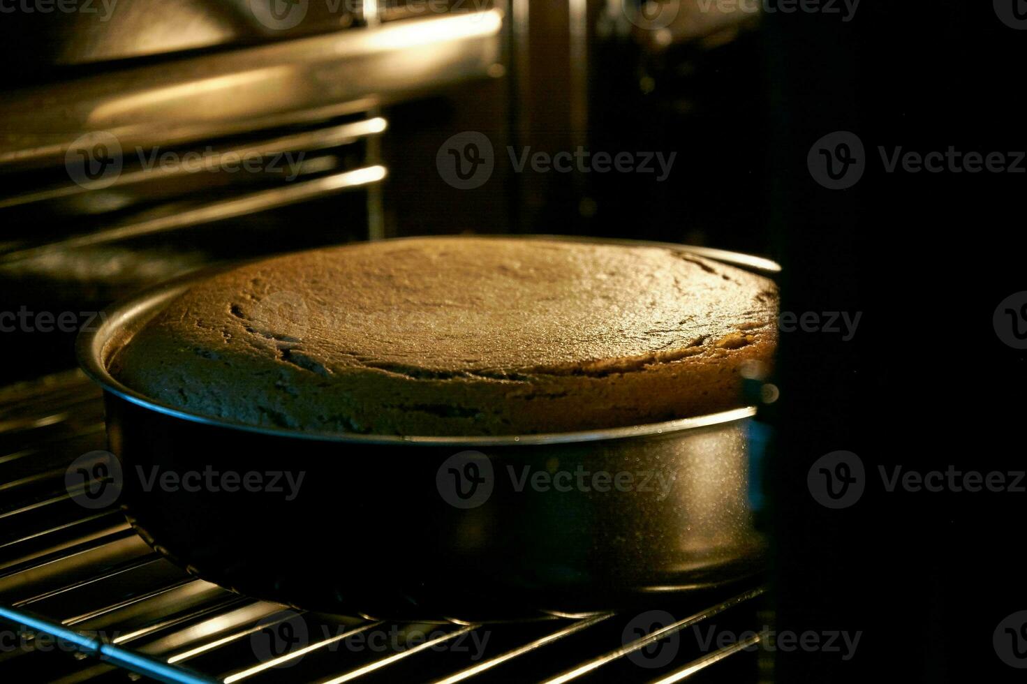 The cake is cooked in the oven photo