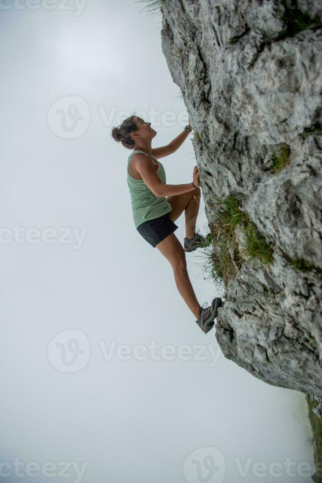 Girl climbing the mountain photo