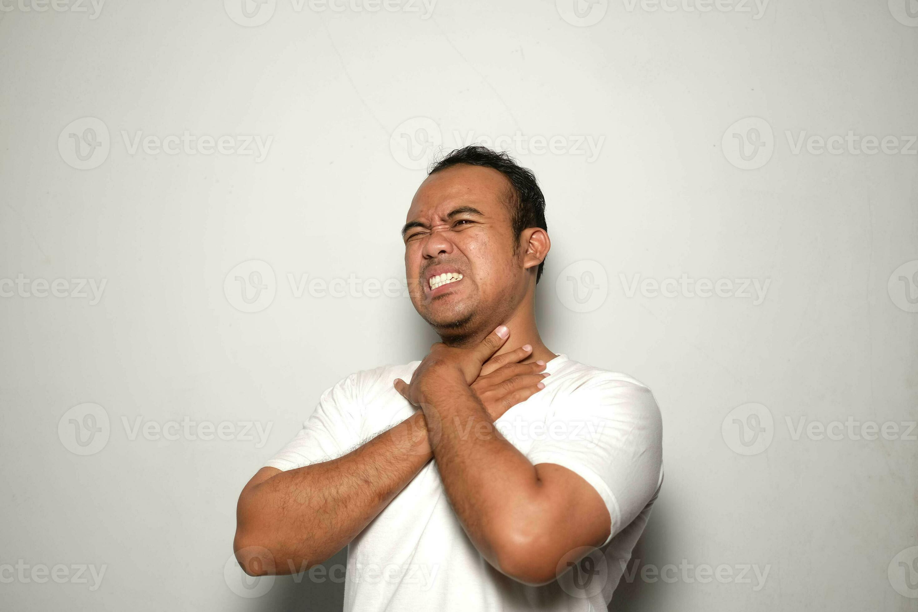 Asian man wearing white T Shirt, isolated white background, Sore throat,  shouting suffocate because painful strangle. health problem. asphyxiate and  suicide concept. 26716726 Stock Photo at Vecteezy