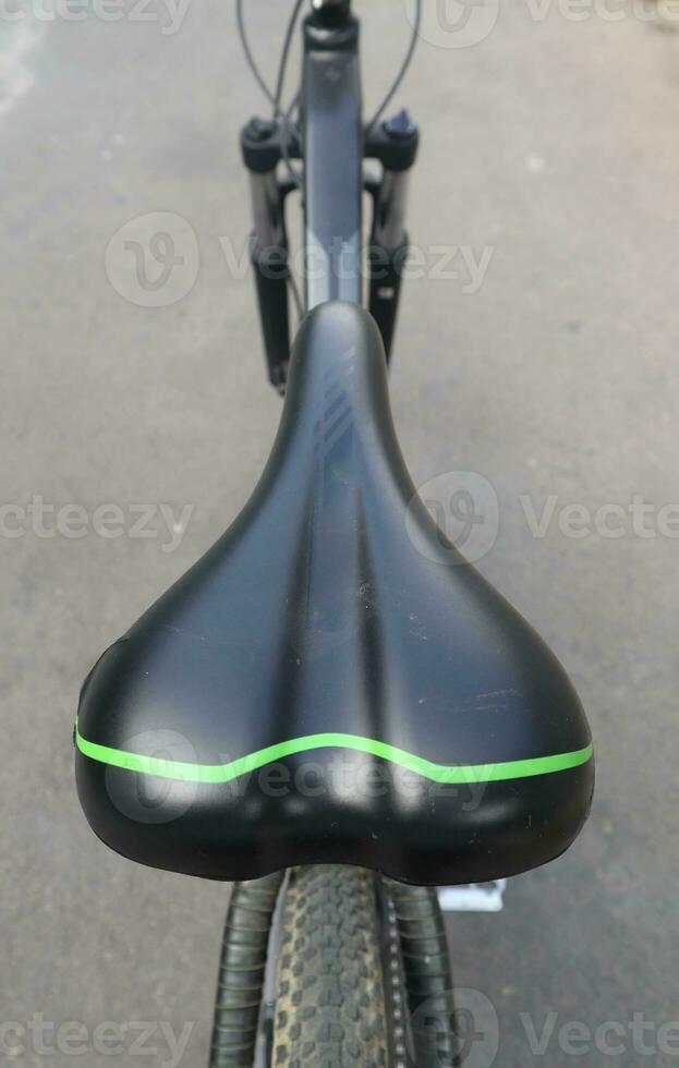 Bicycle seat or black saddle and seatpost isolated on white background photo