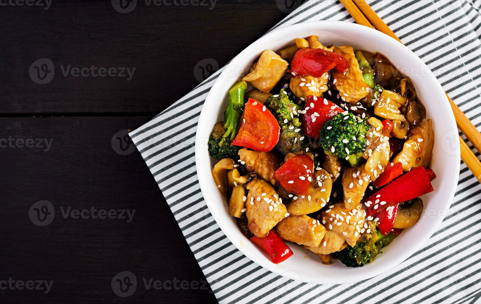 Stir fry with chicken, mushrooms, broccoli and peppers. Chinese food. Top view, overhead photo