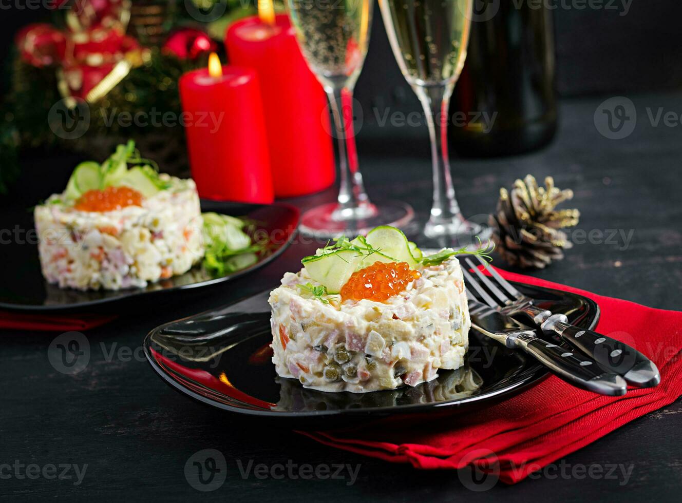 Christmas table setting. Traditional Russian salad Olivier. New Year salad. Festive salad. photo