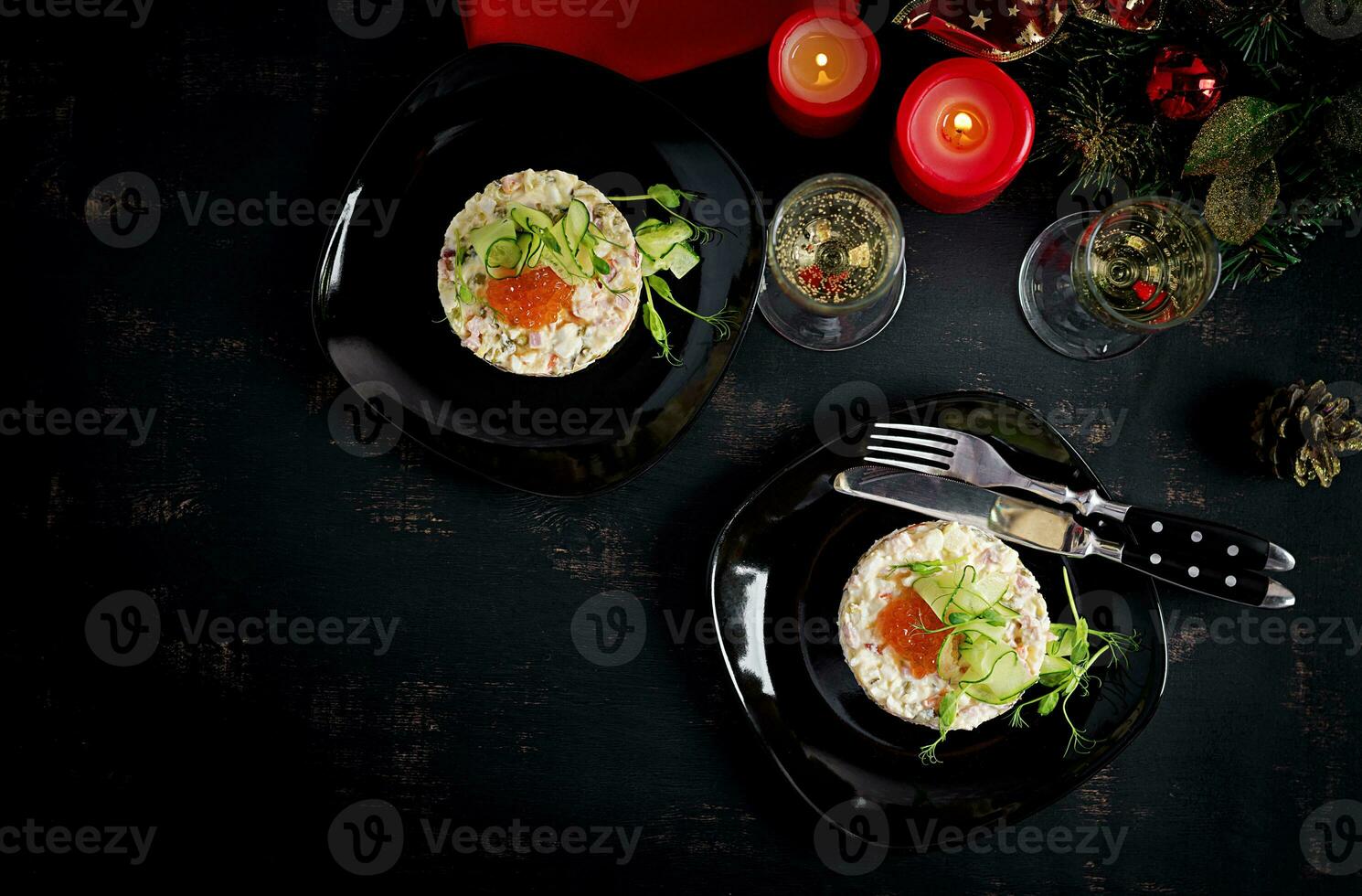 Christmas table setting. Traditional Russian salad Olivier. New Year salad. Festive salad. photo