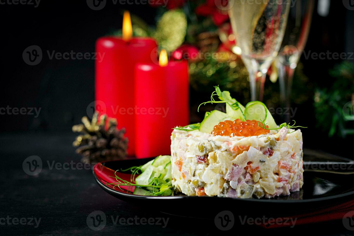 Christmas table setting. Traditional Russian salad Olivier. New Year salad. Festive salad. photo