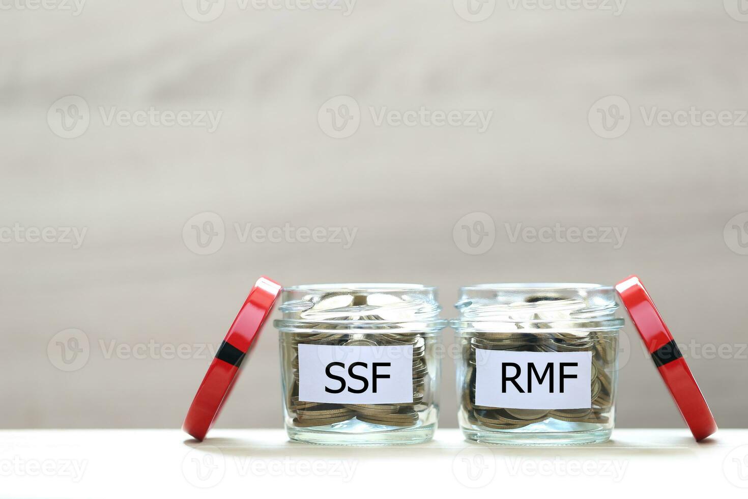 Retirement Mutual Fund, Coins money in the glass bottle on white background, Save money for prepare in future and pension retirement concept photo