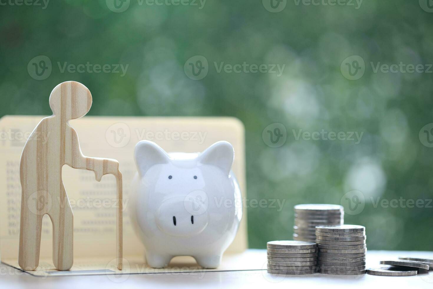 Mutual fund,Senior with piggy bank on natural green background, Save money for prepare in future and pension retirement concept photo