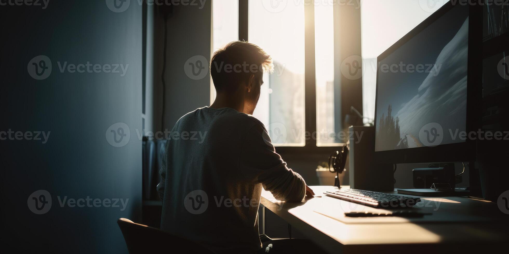 The man works at the computer. photo