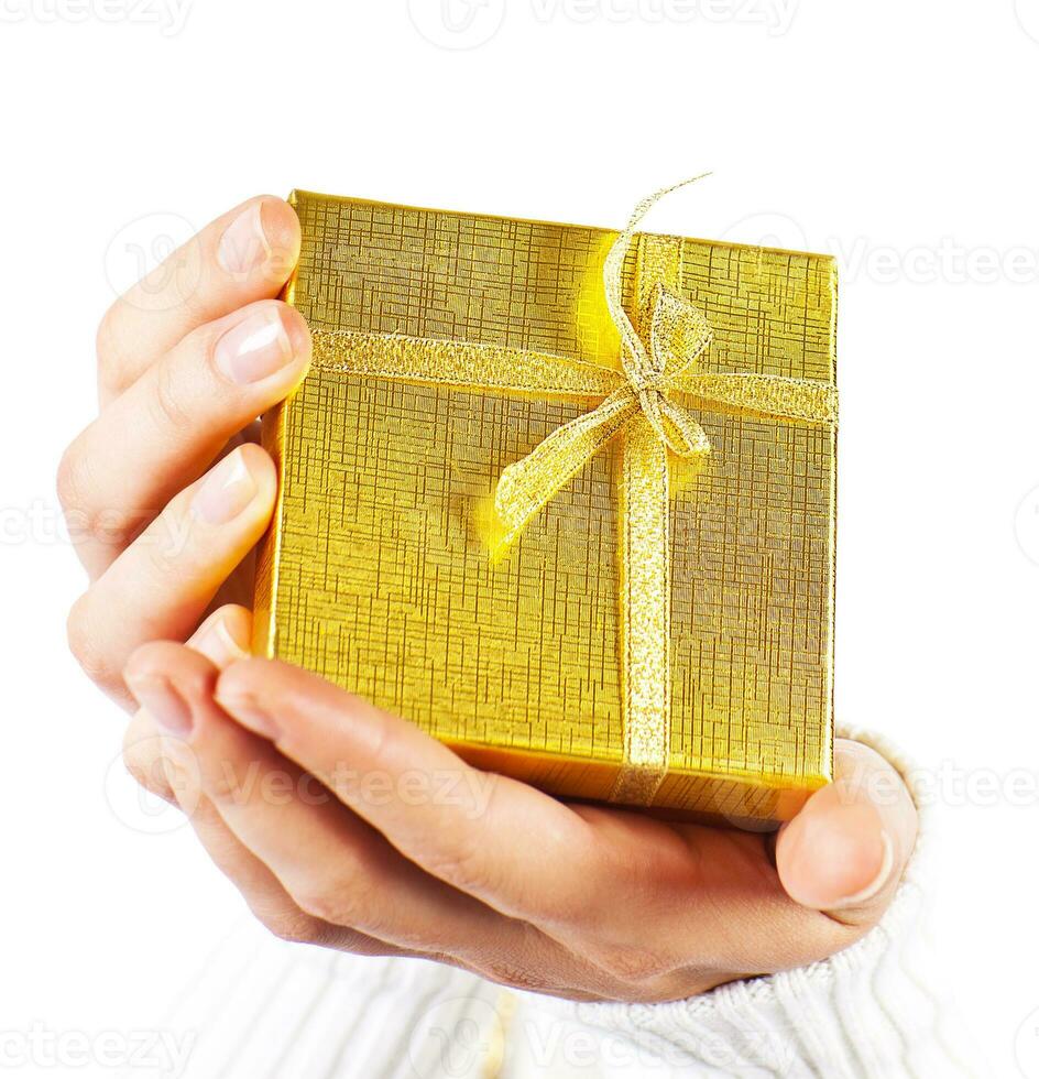 Golden gift in hands photo