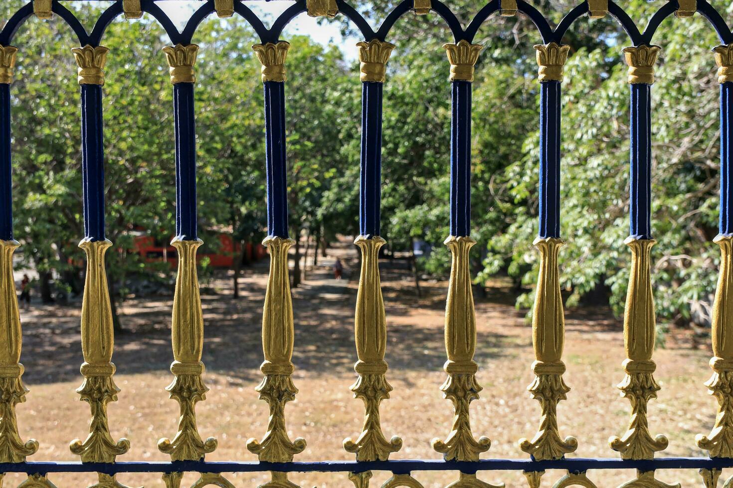 Beautiful fence balustrade with blurred green focus background. photo
