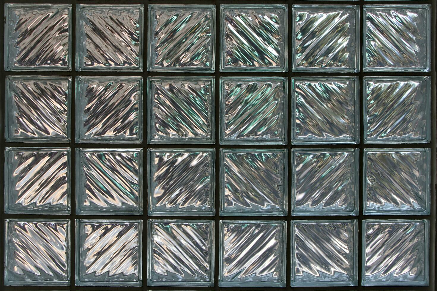 Clear glass block walls allow light to enter the building. photo