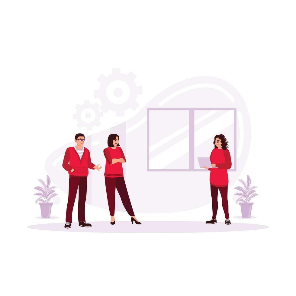 A woman gesturing and discussing something with a smile while her coworkers listen to her standing in the corner of the office. Discussion concept. Trend Modern vector flat illustration
