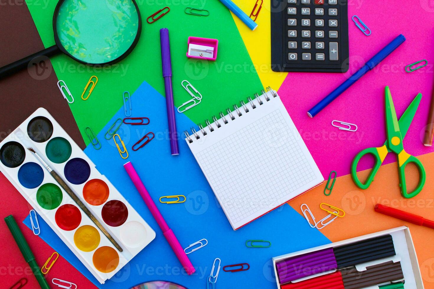 Stationery objects. Office and school supplies on the background of colored paper. back to school. photo