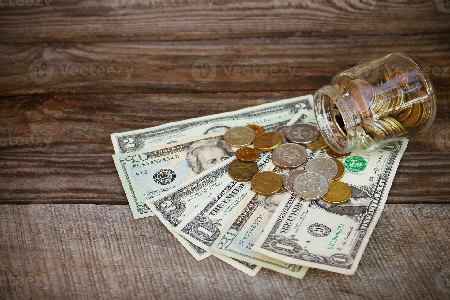 Russian rubles and dollars on the old wooden background. Toned image photo