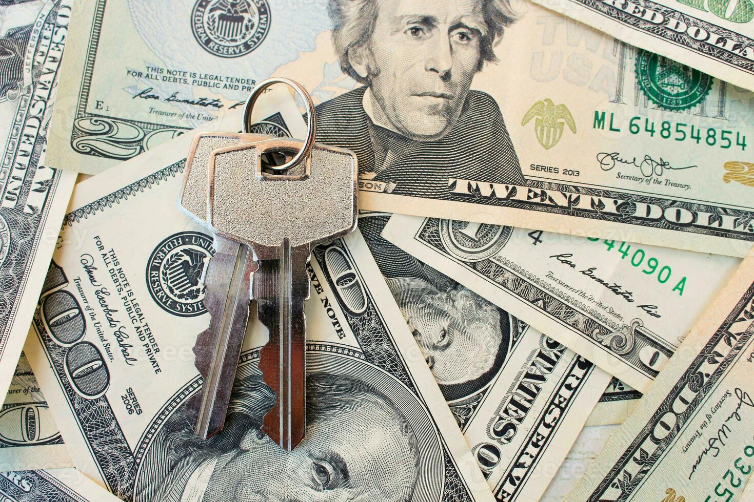The keys on a background of money. photo