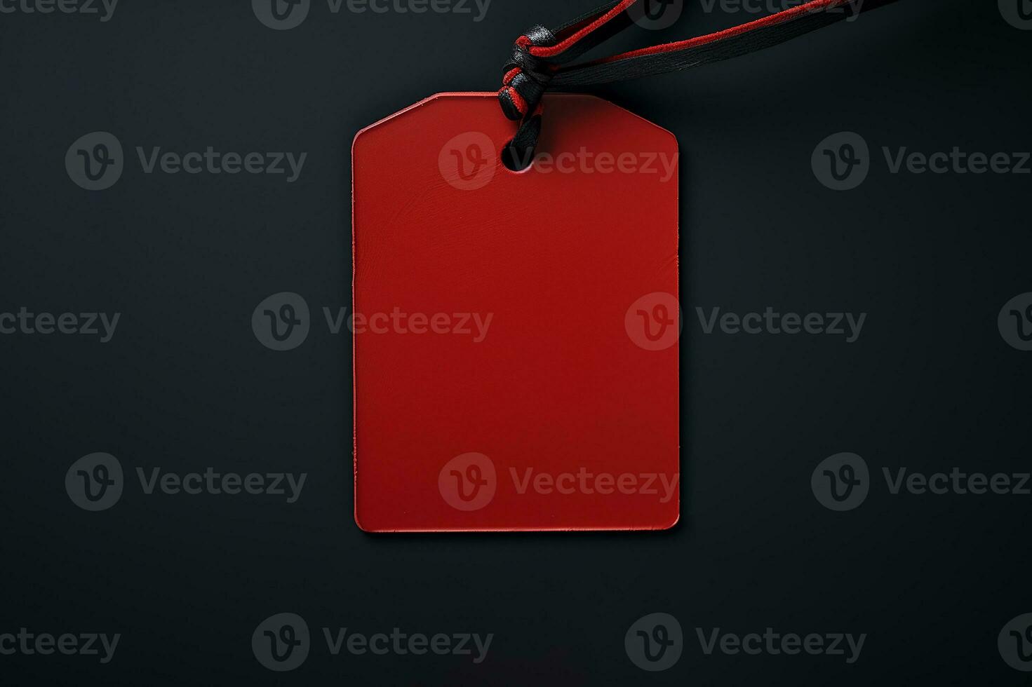 Red empty price tag on black or dark background. Black Friday concept, template copyspace photo