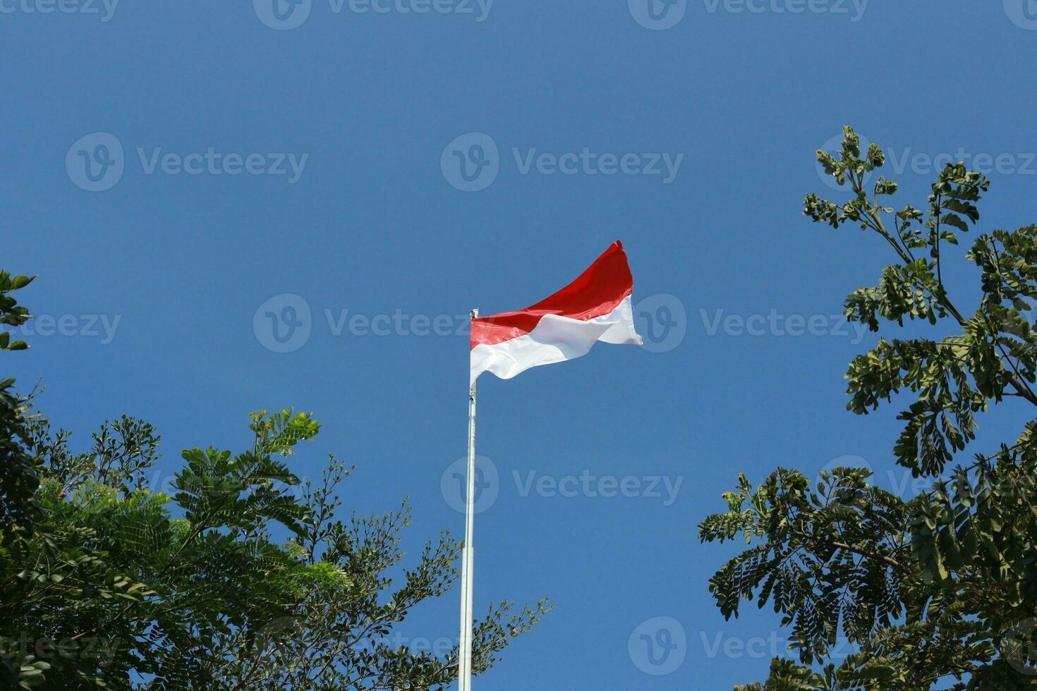 17 August 1945, Indonesian flag against sky background. Independence day concept photo
