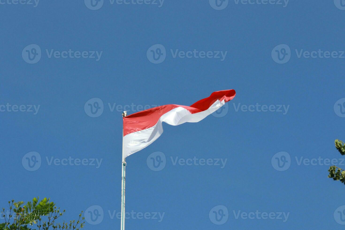17 August 1945, Indonesian flag against sky background. Independence day concept photo