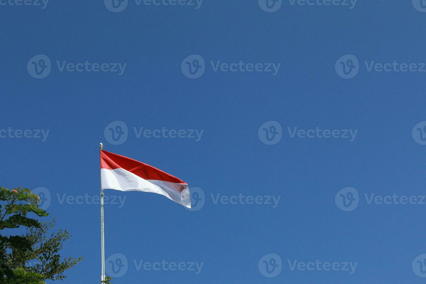 17 August 1945, Indonesian flag against sky background. Independence day concept photo
