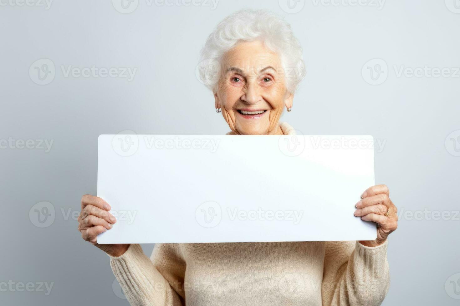 Happy old woman holding blank white banner sign, isolated studio portrait. AI Generated photo