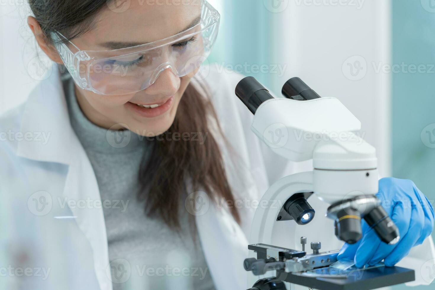 Scientist analyze biochemical samples in advanced scientific laboratory. Medical professional use microscope look microbiological developmental of viral. Biotechnology research in science lab. photo