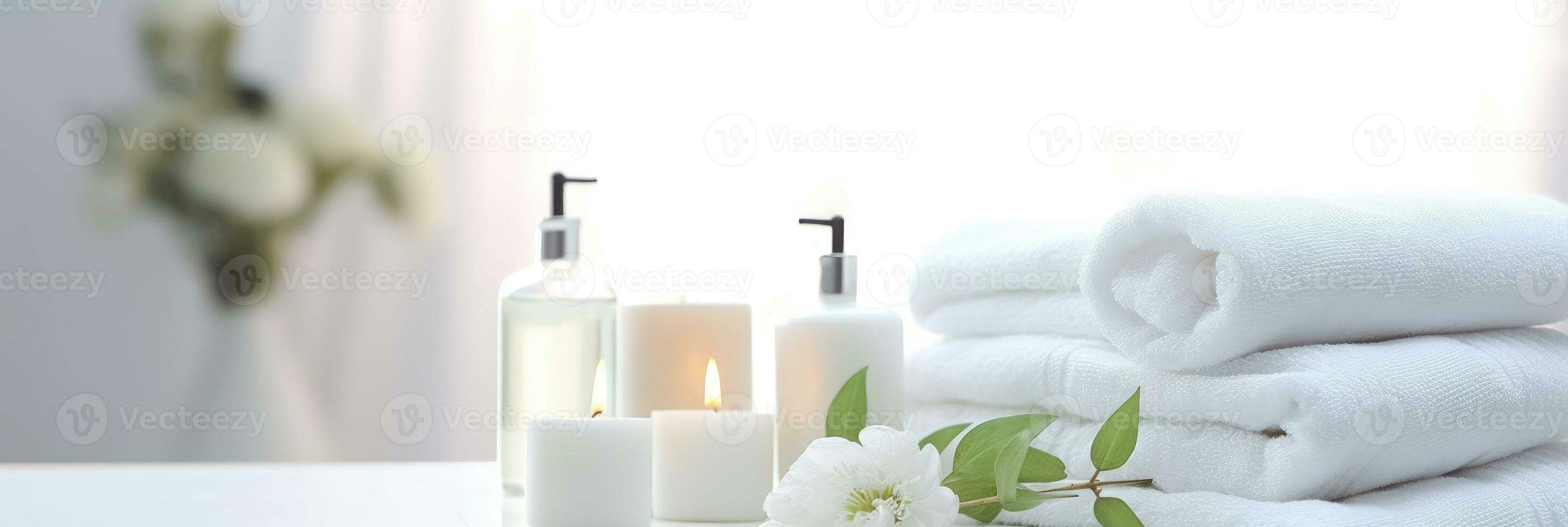 Toiletries, soap, towel on blurred white bathroom spa background. photo