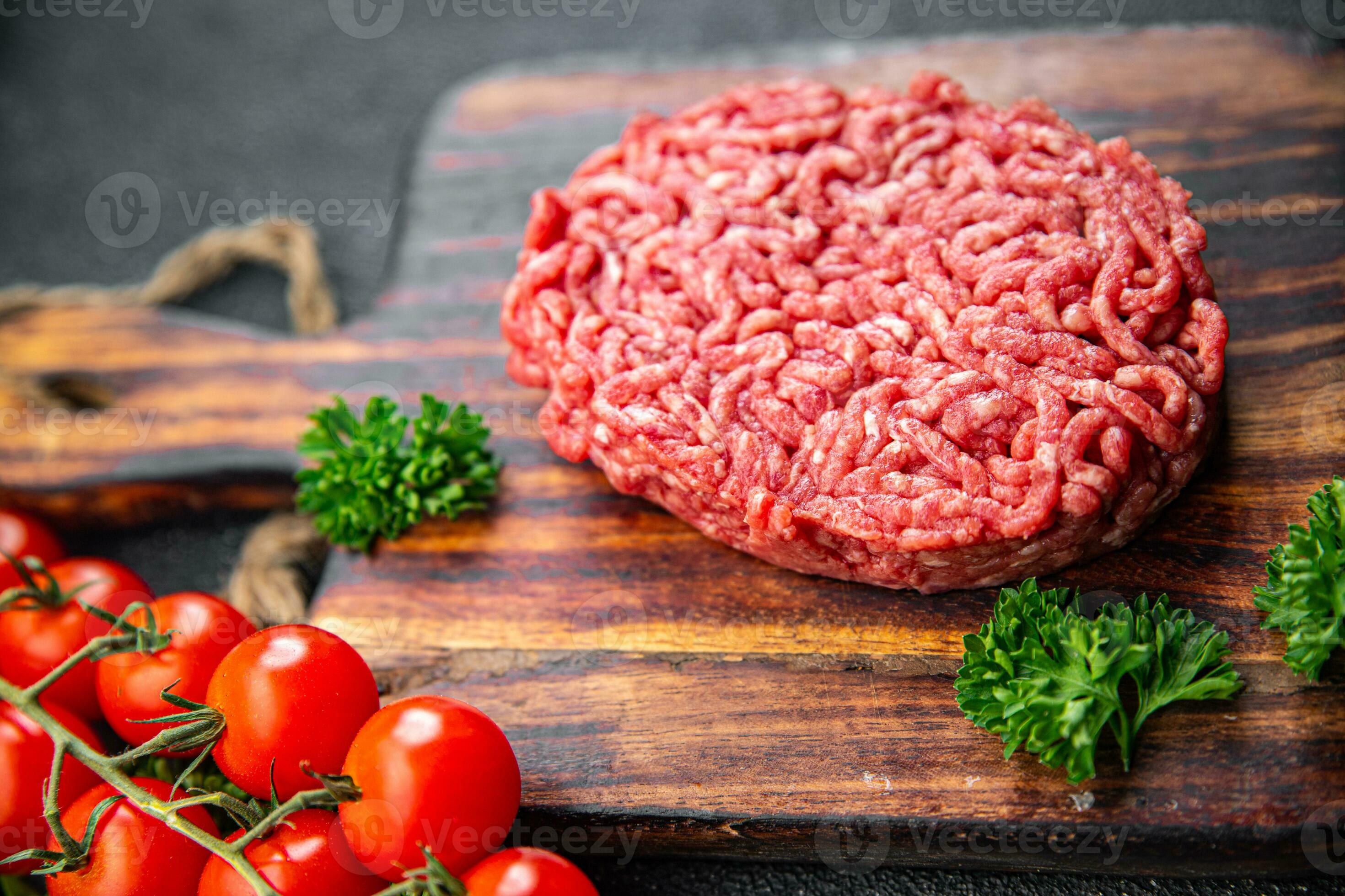 Premium Photo  Raw minced beef and pork chopped in meat grinder, close-up  food background