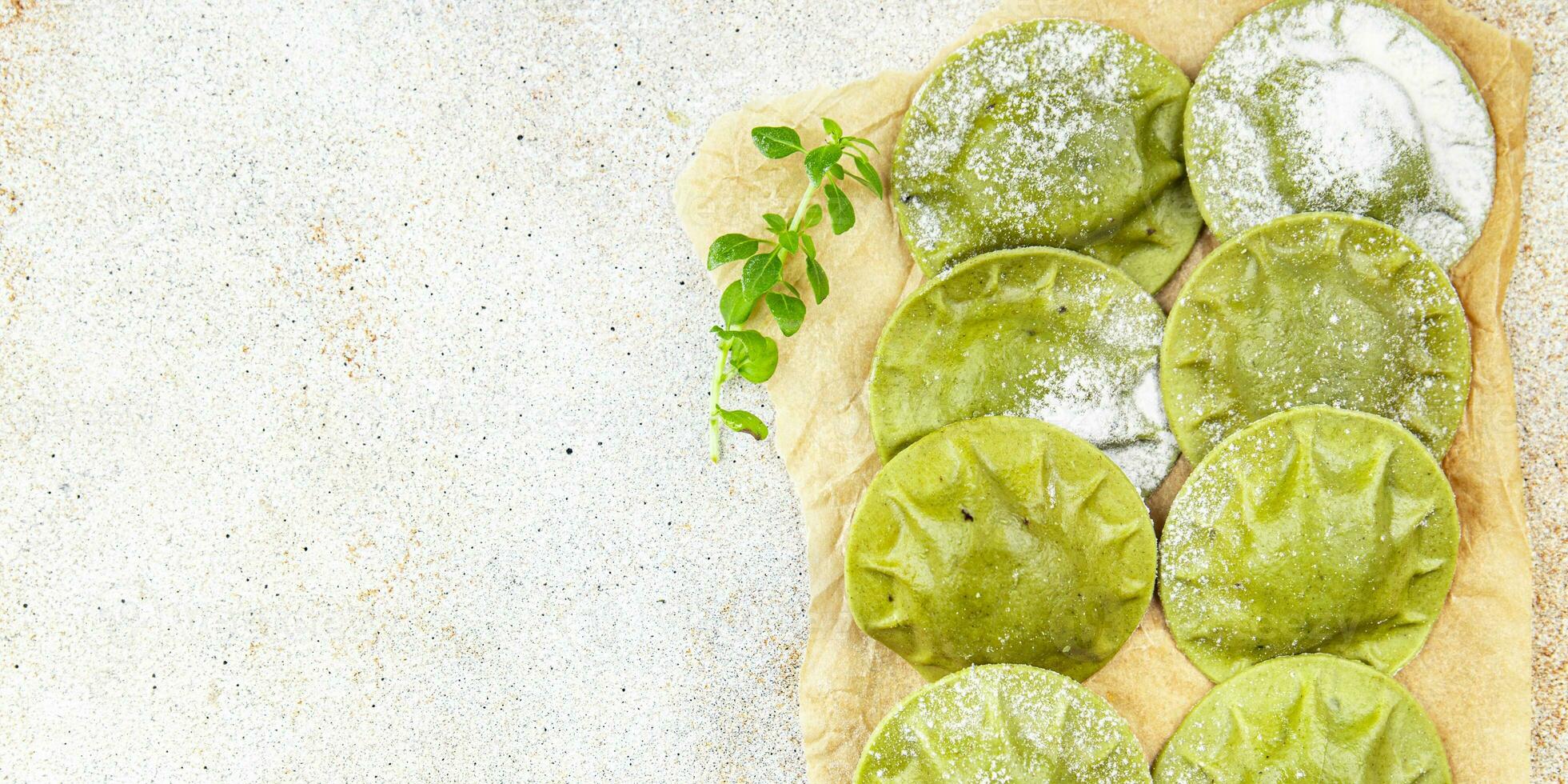 green ravioli green dough spinach, basil vegetable food healthy meal food snack on the table copy space food background rustic top view photo