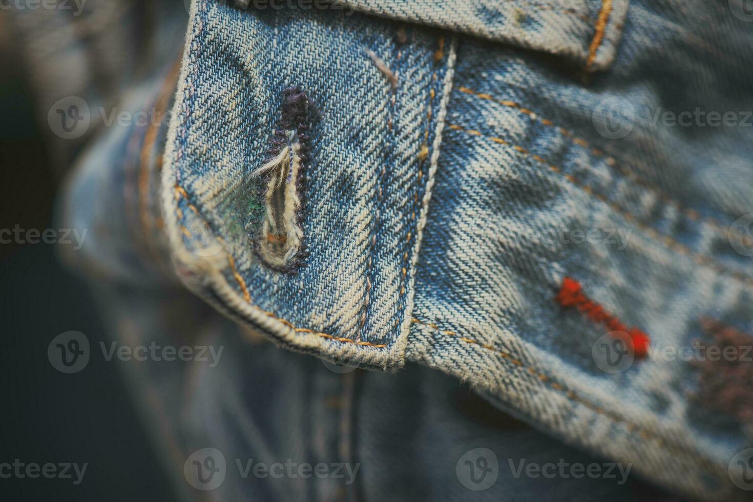 Blue jeans buttonhole detail photo