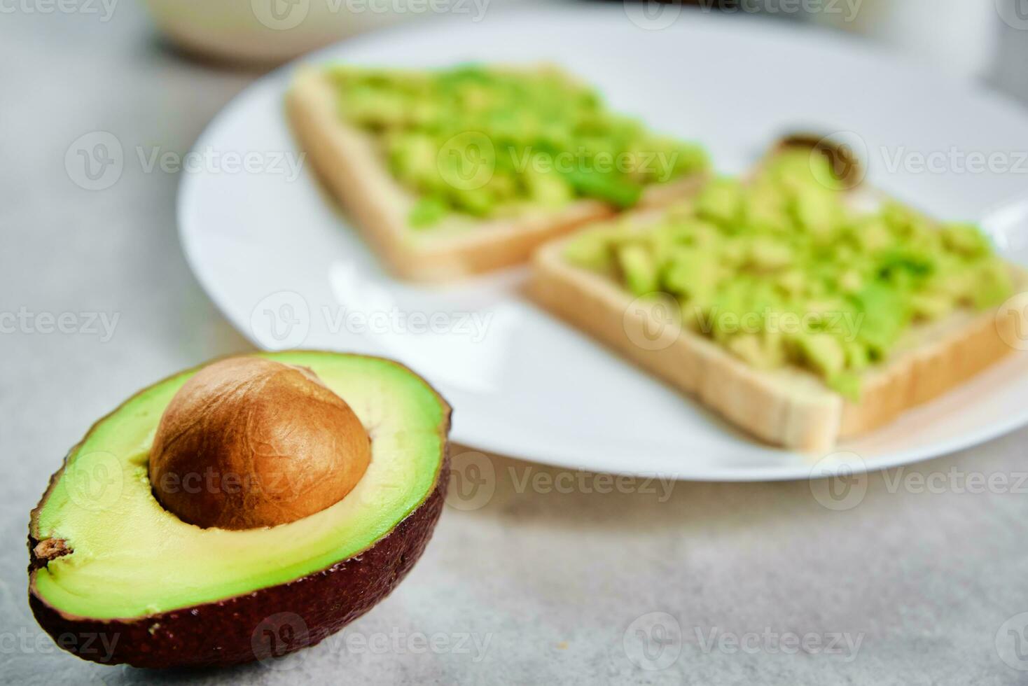 Toasts with avocado on plate, Healthy nutrition photo