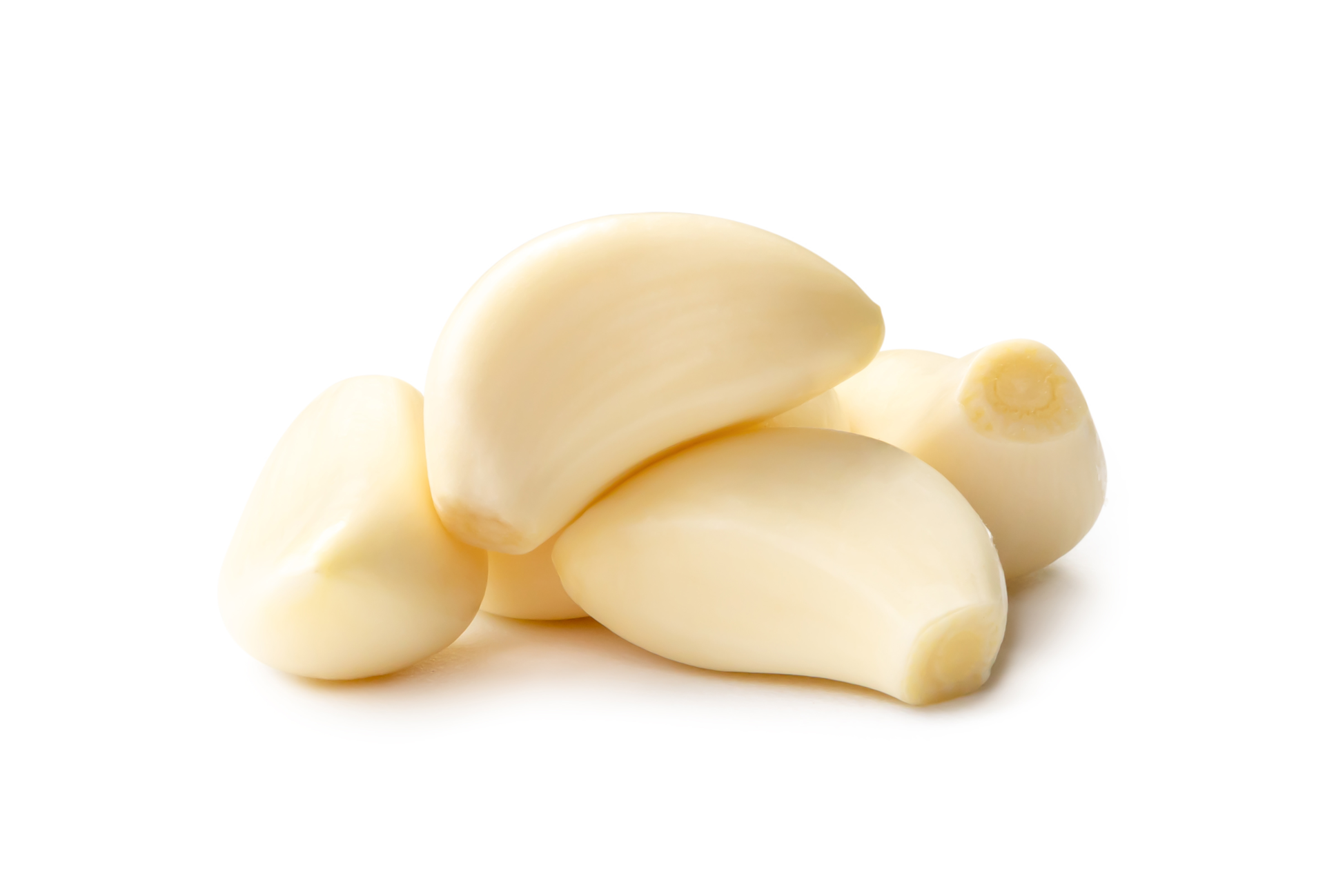 Fresh beautiful whole peeled garlic cloves in stack isolated with