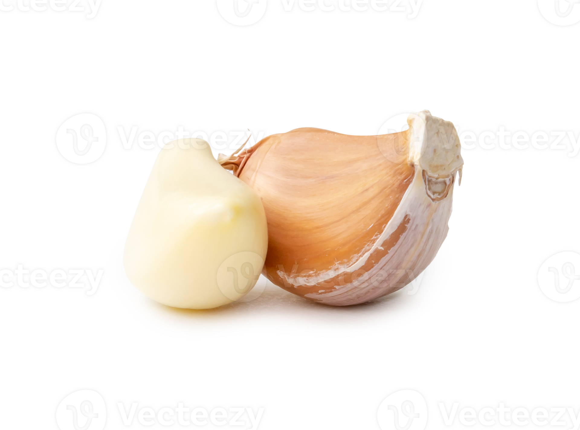 Peeled garlic cloves in stack isolated with clipping path and shadow in