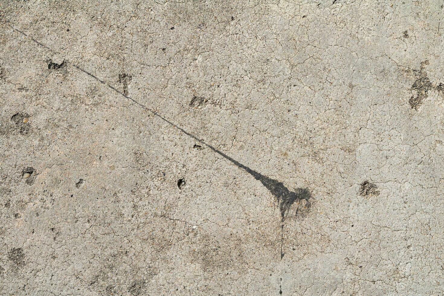 Cracked and abstract grunge texture. Aged material surface backdrop. Weathered effect pattern. Old and dirty background. photo